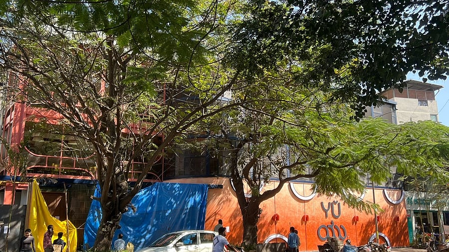 <div class="paragraphs"><p>A large orange façade with glass panels and “YU” written in English and Kannada has come up near the National Public School on 12th A Main Road, HAL 2nd Stage. </p></div>