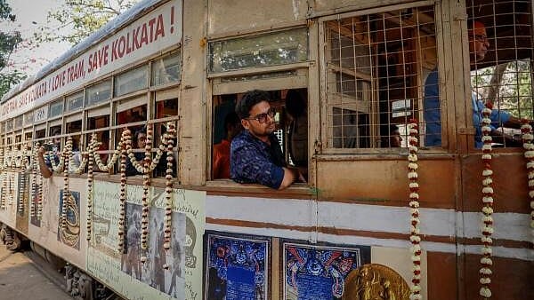 <div class="paragraphs"><p>Passengers sit inside a decorated tram during the 152nd anniversary celebrations of trams in Kolkata.</p></div>