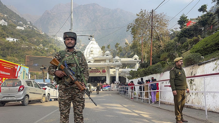 <div class="paragraphs"><p>Security personnel stand guard to ensure safety of devotees visiting the 'Maa Vaishno Devi' temple ahead of the New Year, in Katra.</p></div>