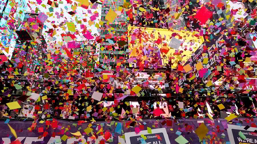 <div class="paragraphs"><p>People throw confetti on a platform while organizers of the upcoming ball drop on New Year's Eve do a confetti test in Times Square, New York, U.S., December 29, 2025.</p></div>