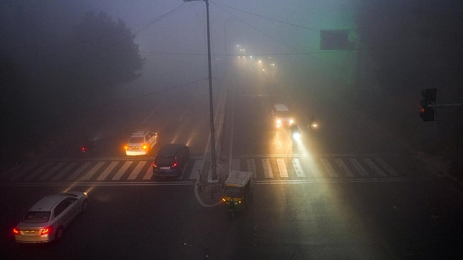 <div class="paragraphs"><p>Vehicles ply a road amid dense fog on a cold winter morning, in New Delhi.</p></div>