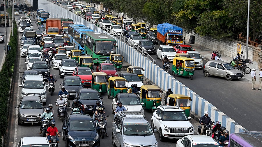 File photo of slow moving traffic seen on Bellary Road near Mehkri Circle. The project will include a 2.25-km tunnel at the Hebbal Junction and a 1.7-km-long rotary flyover over Mehkri Circle. 