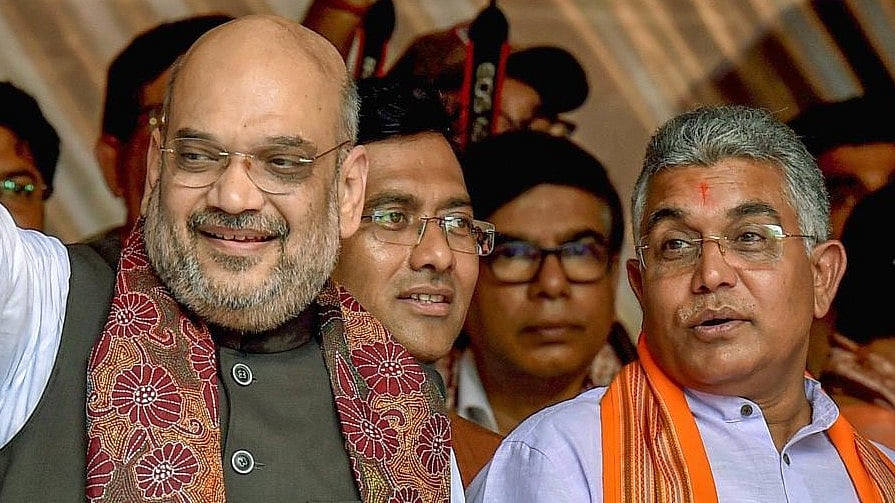 <div class="paragraphs"><p>Union Home Minister Amit Shah and former BJP state president Dilip Ghosh.</p></div>