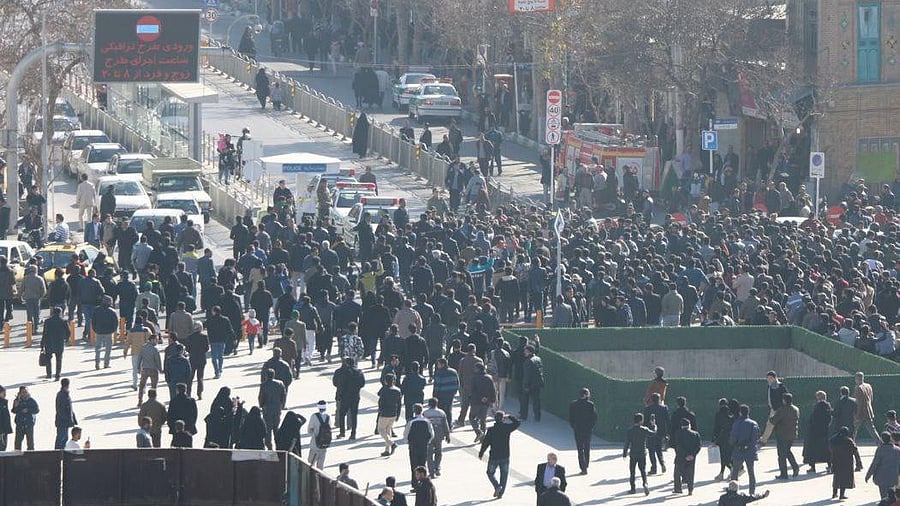 <div class="paragraphs"><p>Protesters march in Iran's capital Tehran on Monday.</p></div>