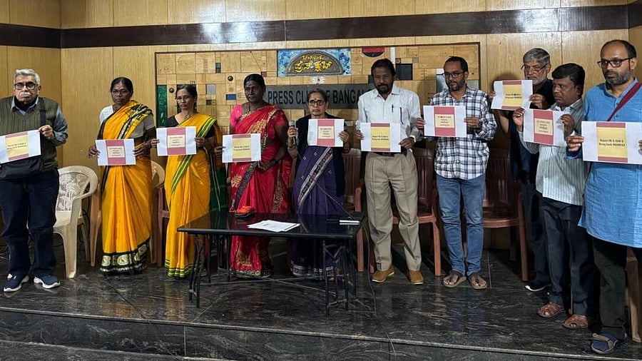 <div class="paragraphs"><p>NREGA activists held pamphlets&nbsp;over proposed ‘VB-GRAMG’ act in Bengaluru.&nbsp;</p></div>