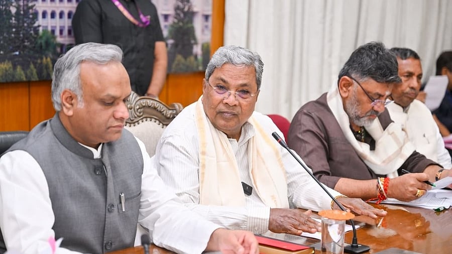 Chief Minister Siddaramaiah addresses a news conference on VB-G RAM G Act in Bengaluru on Saturday. Deputy CM D K Shivakumar, Ministers Priyank Kharge and K H Muniyappa are seen. 