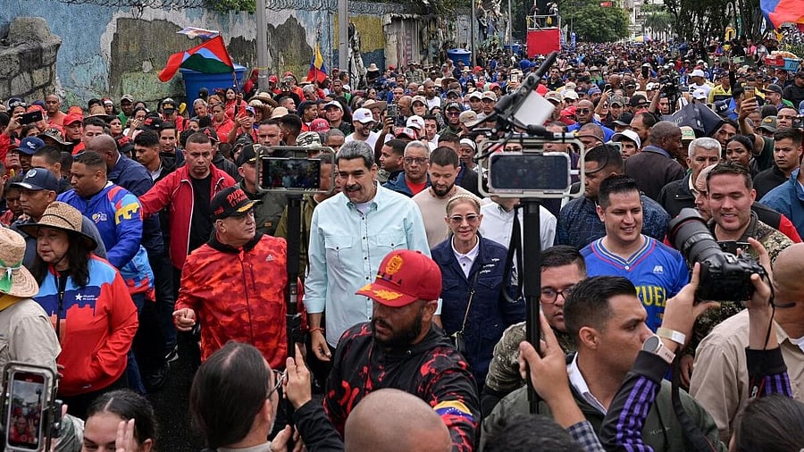 <div class="paragraphs"><p>Venezuela's President Nicolas Maduro, walks with first lady Cilia Flores and Interior Minister Diosdado Cabello, as he joins his supporters during a march to commemorate the Battle of Santa Ines.</p></div>