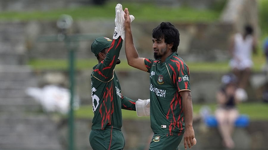 <div class="paragraphs"><p>Bangladesh's Tanzim Hasan, right, celebrates with teammate Litton Das after the dismissal of India's Suryakumar Yadav during the ICC Men's T20 World Cup cricket match between India and Bangladesh at Sir Vivian Richards Stadium in North Sound, Antigua and Barbuda.</p></div>