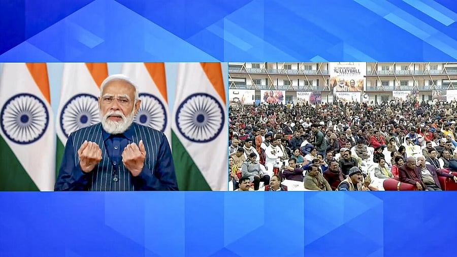 <div class="paragraphs"><p>Prime Minister Narendra Modi, left, addressing the inauguration of the ‘72nd National Volleyball Tournament’ in Varanasi, right, via video conferencing from New Delhi.</p></div>