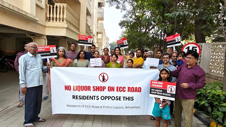 <div class="paragraphs"><p>Residents of Prithvi Layout, Umiya Woods, Prestige Boulevard, Citilights Rustique and Gopalan Atlantis oppose the upcoming liquor shop during a protest on Sunday. </p></div>