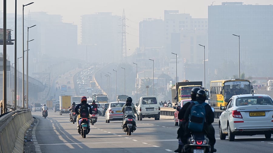 <div class="paragraphs"><p>Vehicles move through thick fog on a chilly morning on the flyover near Yelahanka in Bengaluru on Tuesday, 11th November 2025. </p></div>