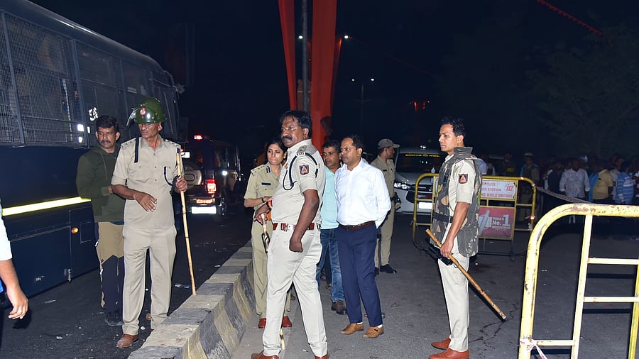 Deputy Commissioner Nagendra Prasad, DIG Vartika Katiyar, Additional SP Ravikumar and others inspect the spot of the firing incident that occurred in front of Janardhana Reddy’s residence at Avvambavi in Ballari.