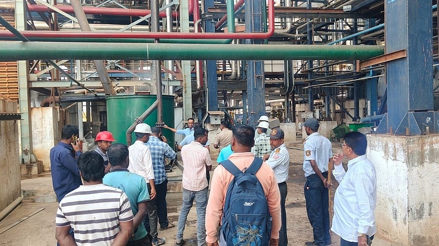 Workers and officials gather at the spot of the incident at the Inamdar sugar factory at Marakumbi village in Bailahongal taluk in Belagavi district. 