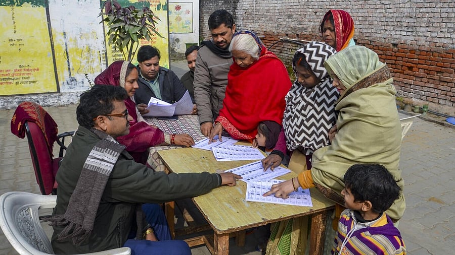 <div class="paragraphs"><p>People search for their names in the draft voter list after the Special Intensive Revision of electoral rolls in Uttar Pradesh, in Mirzapur, Uttar Pradesh, Tuesday, Jan. 6, 2026. </p></div>