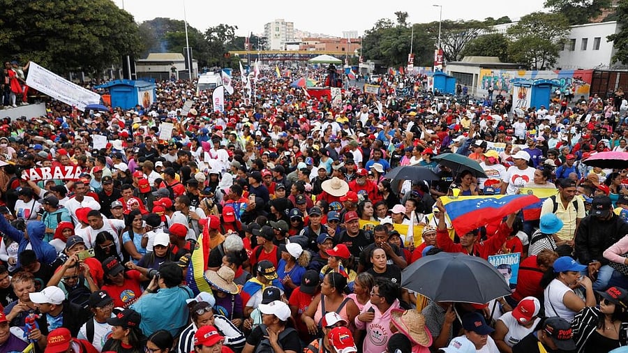 <div class="paragraphs"><p>Government supporters participate in a march calling for the release of Venezuela’s ousted President Nicolas Maduro and his wife, Cilia Flores, after they were captured in a US operation in the capital on January 3, in Caracas, Venezuela.</p></div>