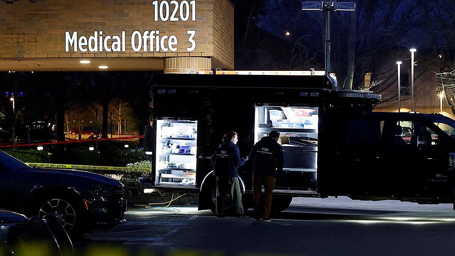 <div class="paragraphs"><p>FBI agents work next to an evidence truck outside Adventist Hospital after US federal agents shot two people in Portland</p></div>