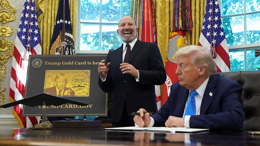 <div class="paragraphs"><p>US Secretary of Commerce Howard Lutnick speaks while standing next to US President Donald Trump</p></div>