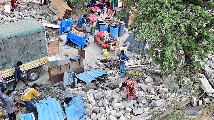 <div class="paragraphs"><p>Residents salvage household items amid debris on the second day of the BDA’s encroachment removal drive at Thanisandra on Friday. </p></div>