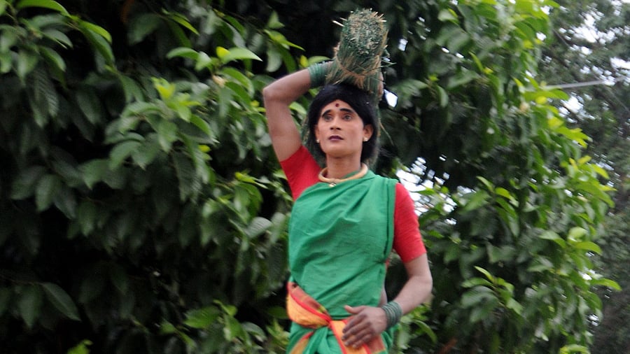 A man dressed as the woman carrying paddy heap on her head, the JD(S) symbol, is a regular appearance in the party's election campaigns.  