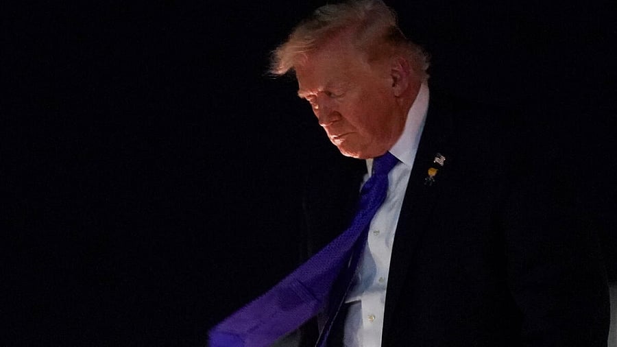 <div class="paragraphs"><p>US President Donald Trump disembarks from Air Force One after arriving at Palm Beach International Airport, West Palm Beach, Florida, US.</p></div>