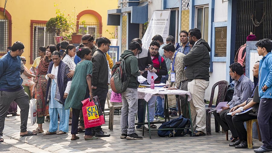 <div class="paragraphs"><p>People gather at a centre during hearings under the Special Intensive Revision (SIR) of the electoral rolls, in Kolkata.</p></div>