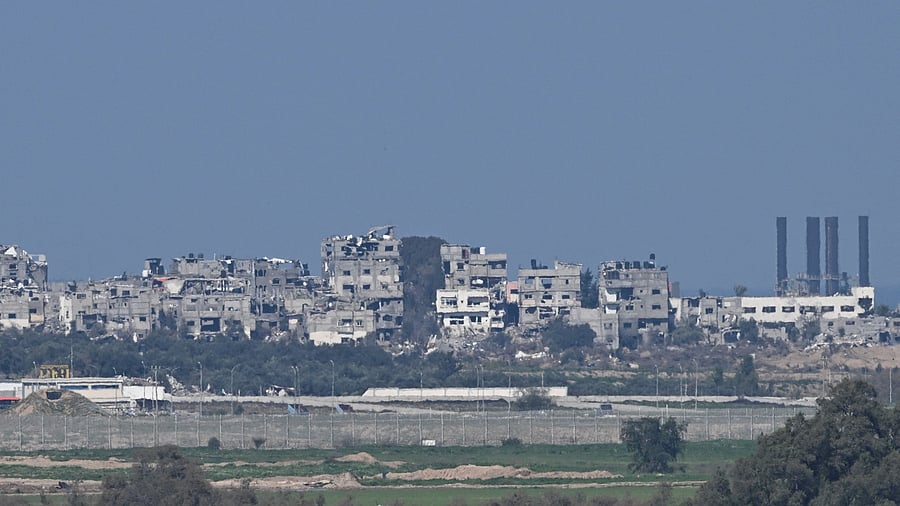 <div class="paragraphs"><p>Heavily damaged buildings lie at a bombed-out area of the Gaza Strip</p></div>