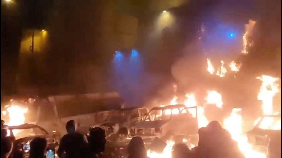 <div class="paragraphs"><p>Protesters gather as vehicles burn, amid evolving anti-government unrest, in Tehran, Iran, in this screen grab obtained from a social media video.</p></div>