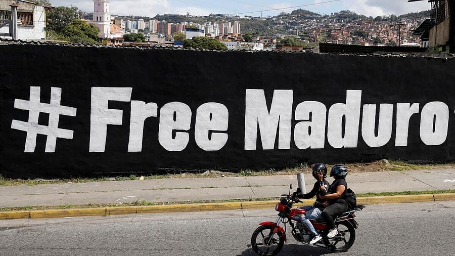 <div class="paragraphs"><p>A motorcyclist passes in front of a mural that says "Free Maduro", days after the U.S. launched a strike on Venezuela and captured its President Nicolas Maduro and his wife, Cilia Flores, in Caracas, Venezuela, January 11, 2026.</p></div>