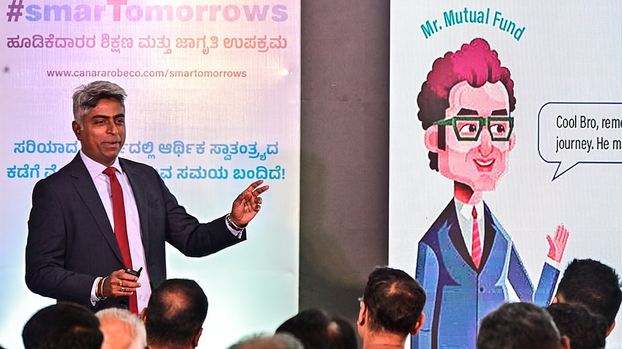 Sadanand Pyati, zone sales head, Canara Robeco, gives a presentation about mutual funds at an investor education and awareness initiative held at the Deccan Herald-Prajavani office in Bengaluru on Monday.