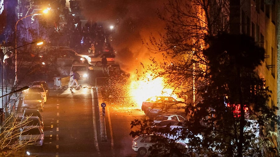 <div class="paragraphs"><p>Cars burn in a street during a protest over the collapse of the currency's value, in Tehran, Iran, January 8, 2026. </p></div>