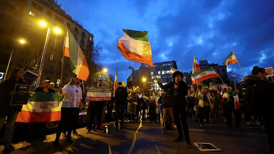 <div class="paragraphs"><p>People wave flags during a demonstration in support of the national protests in Iran, in Barcelona, Spain January 13, 2026.</p></div>