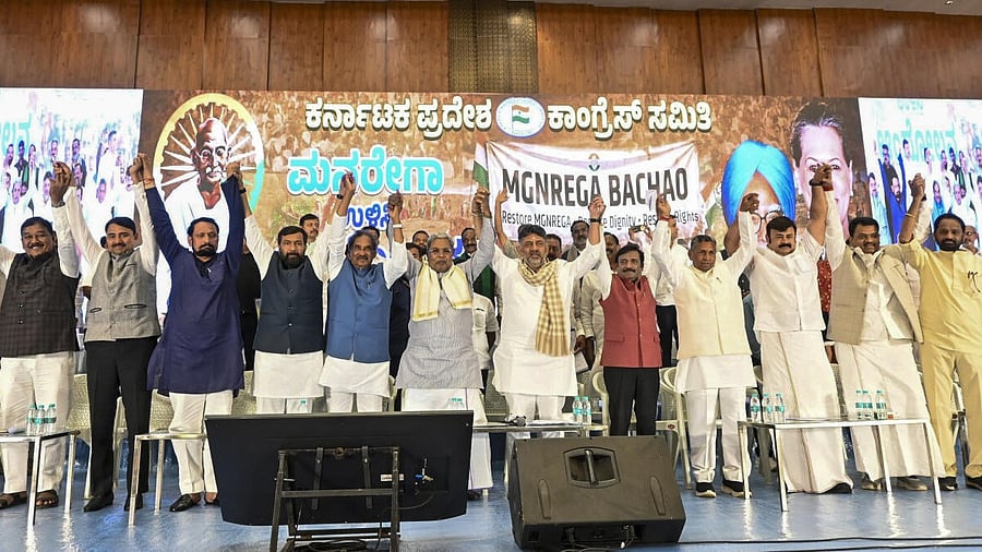 <div class="paragraphs"><p>Karnataka Chief Minister Siddaramaiah, state Deputy Chief Minister DK Shivakumar with other leaders during the ‘MGNREGA Bachao Sangram’, a mass outreach campaign over the replacement of the Mahatma Gandhi National Rural Employment Guarantee Act (MGNREGA) with the Viksit Bharat-Guarantee for Rozgar and Ajeevika Mission Act, or VB-G RAM G, in Bengaluru, Tuesday, Jan. 13, 2026.</p></div>