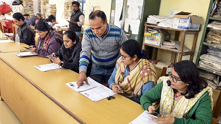 <div class="paragraphs"><p>Representative image of BLOs verifying filled enumeration forms as part of SIR.&nbsp;</p></div>