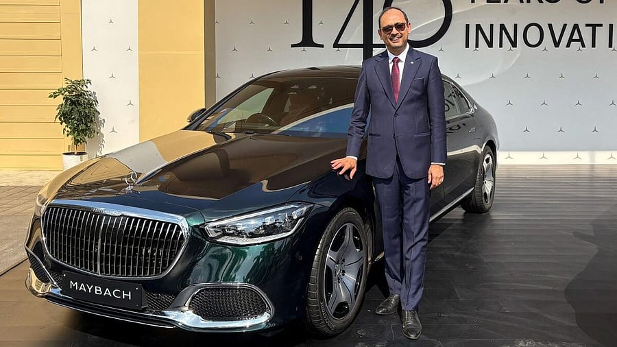 <div class="paragraphs"><p>Mercedes-Benz India CEO Santosh Iyer poses beside a Maybach car.</p></div>