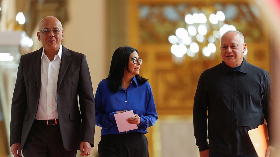 <div class="paragraphs"><p>Venezuela's interim President Delcy Rodriguez walks with Venezuela's National Assembly President Jorge Rodriguez and Venezuela's Interior Minister Diosdado Cabello</p></div>
