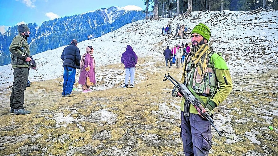 <div class="paragraphs"><p>Armed Special Operations Group (SOG) personnel of the Jammu and Kashmir Police stand guard as tourists experience snow activities, at Guldanda in Bhaderwah. </p></div>
