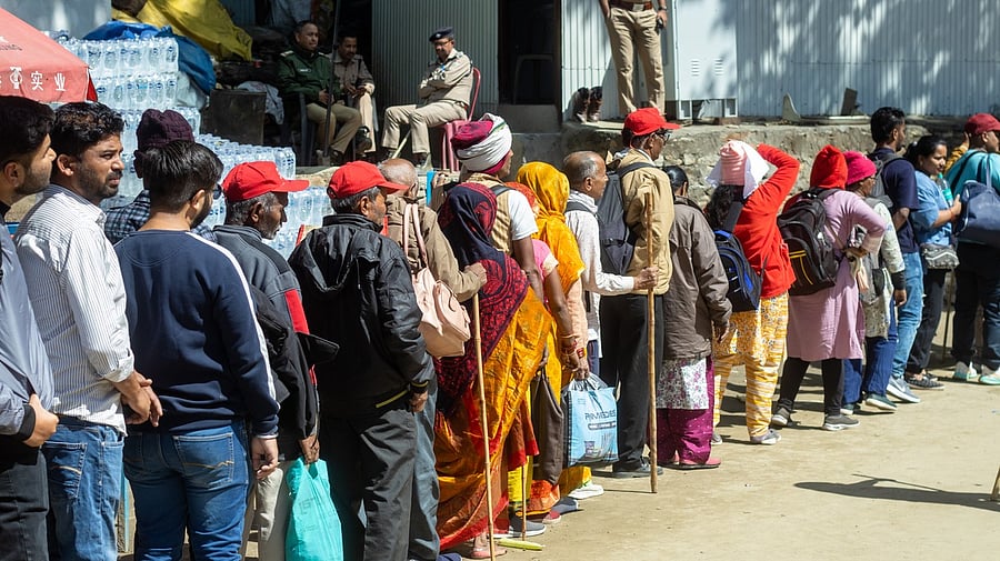 <div class="paragraphs"><p>People standing in a line.&nbsp;</p><p>Photo for representational puroose.</p></div>