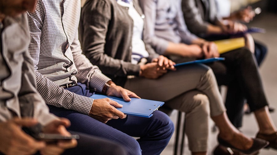 <div class="paragraphs"><p>Large group of unrecognizable business people waiting for a job interview. (Representative image)</p></div>