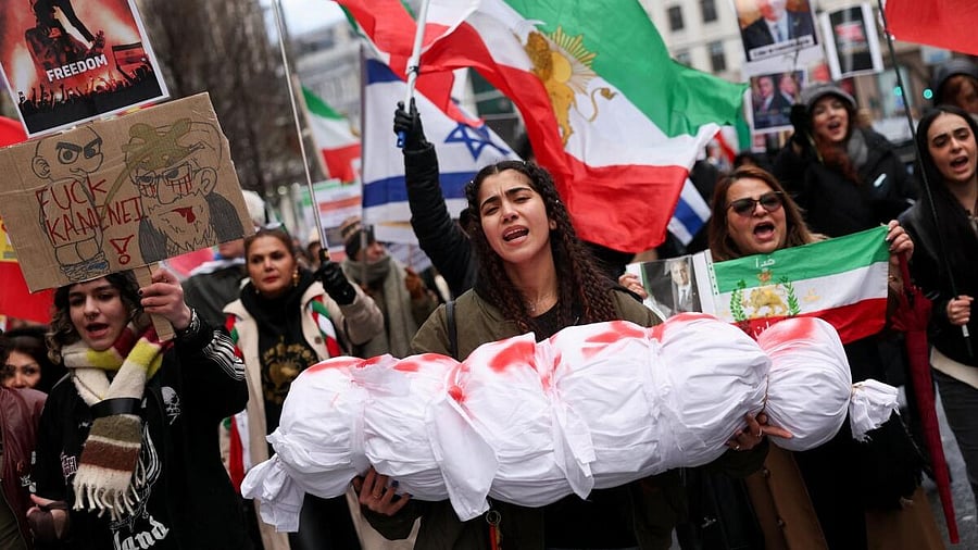 <div class="paragraphs"><p>A protester holds a mock body bag during a rally in support of nationwide protests in Iran.</p></div>