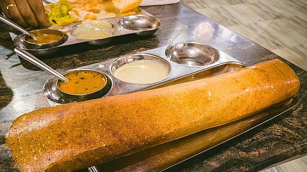 <div class="paragraphs"><p>When I stepped inside the moving rath, I saw a BJP karyakarta serving him lunch—a masala dosa with sambar and chutney.</p></div>