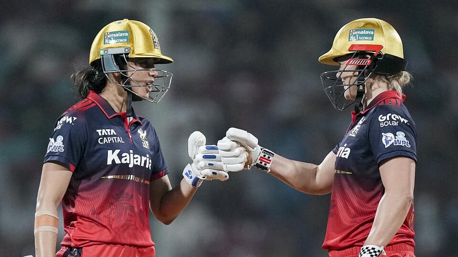 <div class="paragraphs"><p>Royal Challengers Bengaluru's captain Smriti Mandhana, left, with teammate Georgia Voll during the Women's Premier League (WPL) T20 cricket match.</p></div>