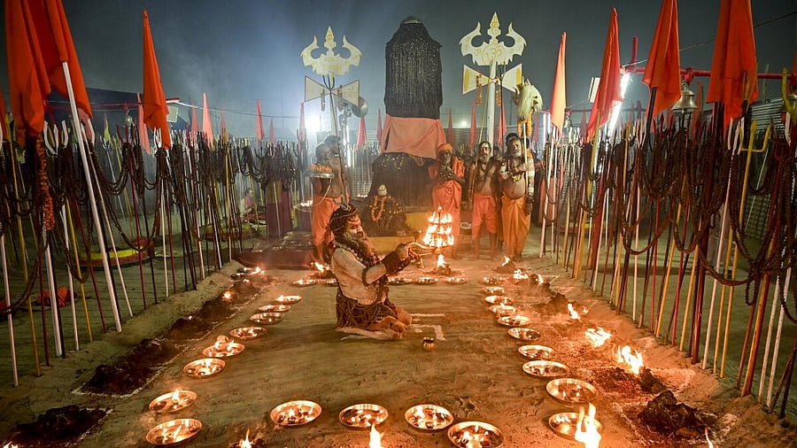 <div class="paragraphs"><p>Seers perform evening rituals near the Sangam during the 'Magh Mela 2026' festival, in Prayagraj.PTI</p></div>