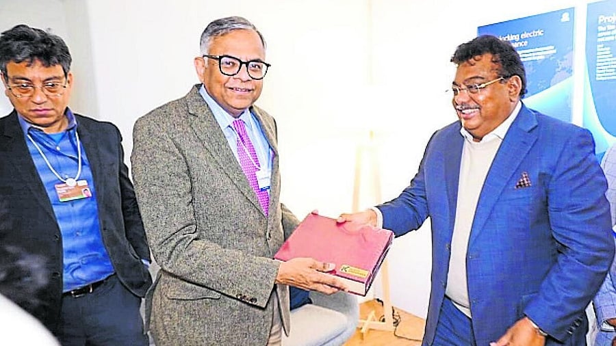 <div class="paragraphs"><p>Minister for Large and Medium Industries MB Patil presents a memento to Tata Group Chairman N Chandrasekaran in Davos on Monday.</p></div><div class="paragraphs"><p></p></div>