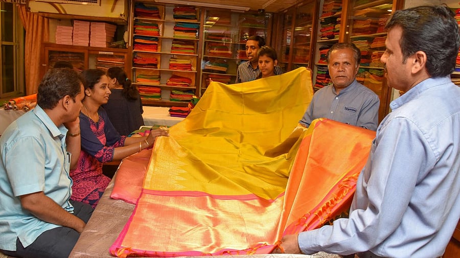 <div class="paragraphs"><p>People purchasing silk Saris for Ugadi festival in Vijayalakshmi Silks and Sarees, M G Road in Bengaluru. </p></div>