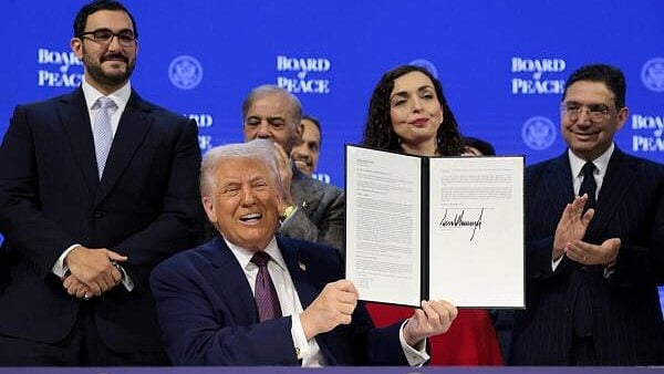 <div class="paragraphs"><p>U.S. President Donald Trump takes part in a charter announcement for his Board of Peace initiative aimed at resolving global conflicts, alongside the 56th annual World Economic Forum (WEF), in Davos</p></div>