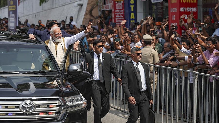 <div class="paragraphs"><p>In this image released on Jan. 23, 2026, Prime Minister Narendra Modi greets people during a roadshow upon his arrival, in Thiruvananthapuram, Kerala.</p></div>