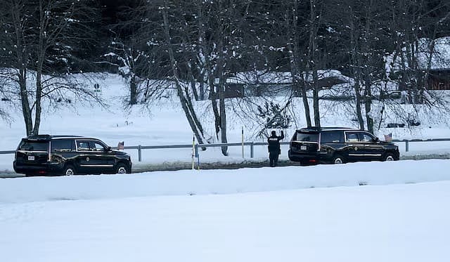 <div class="paragraphs"><p>A police officer stands by a vehicle from U.S. President Donald Trump's motorcade, as President Trump travels from his hotel to attend the 56th annual World Economic Forum (WEF), in Davos, Switzerland</p></div>
