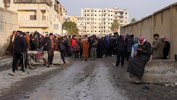 <div class="paragraphs"><p>Relatives of detainees who were set free from al-Aqtan prison gather, following the control of the prison by the Syrian government, in Raqqa, Syria.</p></div>