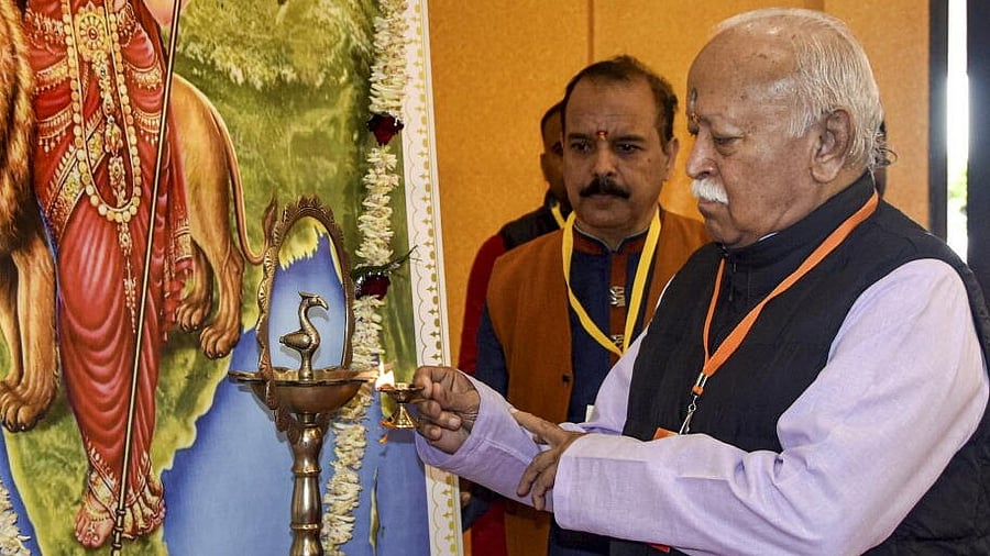 <div class="paragraphs"><p>RSS chief Mohan Bhagwat lights a lamp during a meeting titled 'Janjatiya Sanwad', in Ranchi.</p></div>