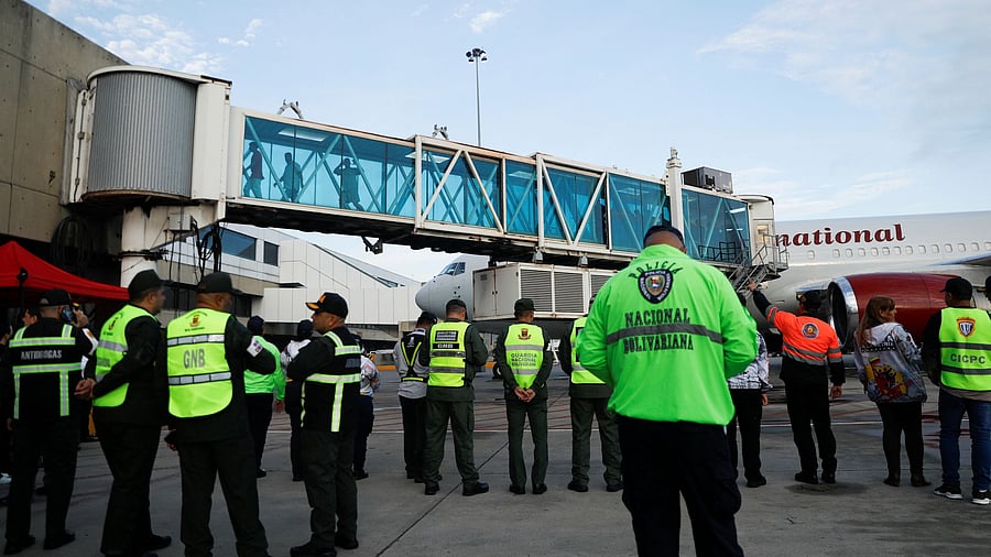 <div class="paragraphs"><p>Venezuelan migrants react after arriving on a deportation flight from the United States at Simon Bolivar International Airport, in Maiquetia, Venezuela </p></div>
